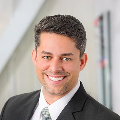 A headshot photo of Dr. Yamil Reeves, a dentist at Great Smile Dental